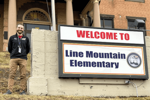 David Reick standing in front of Line Mountain Elementary