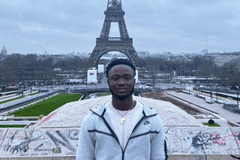 Ibrahima Barry near the Eiffel Tower in Paris, France