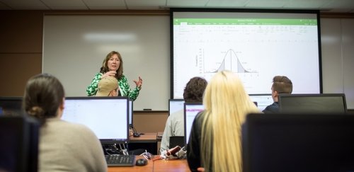 Professor and students in a classroom during an ITA class