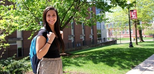 Female Commonwealth University - Bloomsburg student standing outside Hartline Science Center.