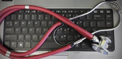 Stethoscope laying on laptop keyboard