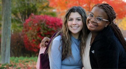 Female college students pose for photo on the quad at Commonwealth University - Bloomsburg in the fall