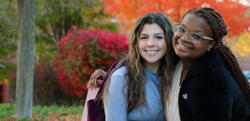 Female college students pose for photo on the quad at Commonwealth University - Bloomsburg in the fall