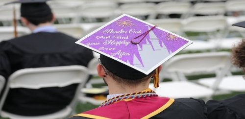 Graduate decorated cap, reading: 'Reach out and find your happily ever after'