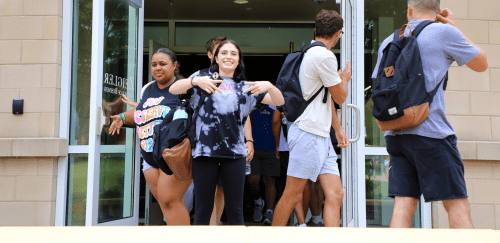 Husky Life - Students walking out of Sutliff Hall on the Bloomsburg campus