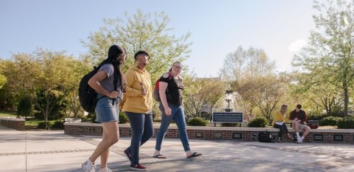 Three students walking on the Bloomsburg campus