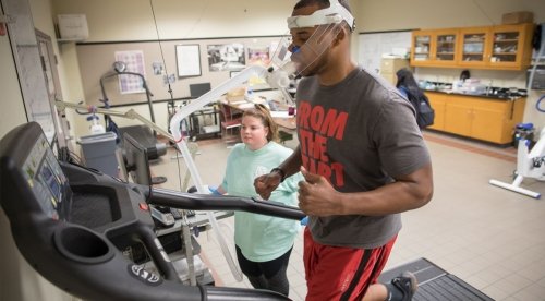 CU-Bloomsburg student runs on treadmill as another student reviews results