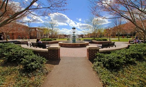 Students enjoy a spring afternoon at Commonwealth University-Bloomsburg, formerly Bloomsburg University, on the Academic Quad at Bloomsburg.