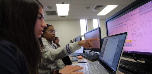 Commonwealth University students view a computer screen in a classroom