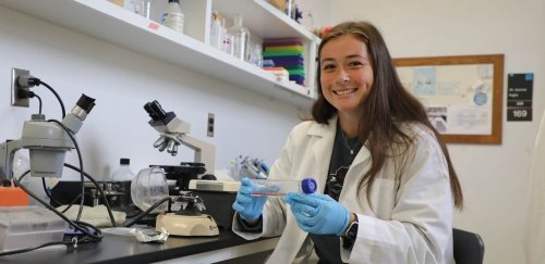 Commonwealth University student in a science lab