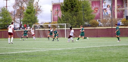 Soccer player takes a shot just outside the box at Commonwealth University-Bloomsburg, formerly Bloomsburg University.