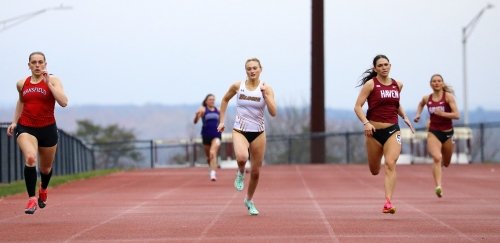 Runners compete in the 800 meter dash at a triad track and field meet at Commonwealth University-Bloomsburg, formerly Bloomsburg University.
