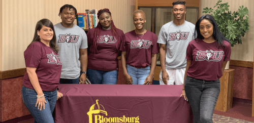 CU-Bloomsburg Multicultural Affairs staff at a table