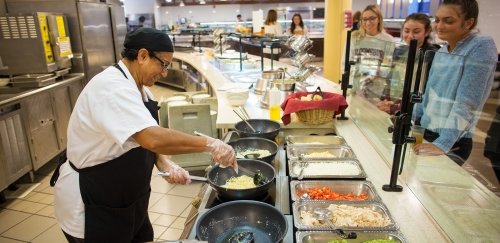 Chef at Commonwealth University-Bloomsburg, formerly Bloomsburg University, serves students dinner at the Scranton Commons.