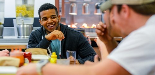 Friends enjoy a meal at Bentley Hall at Commonwealth University-Lock Haven, formerly Lock Haven University.