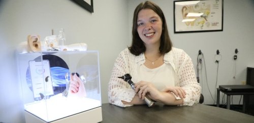 Audiology student sitting at a table