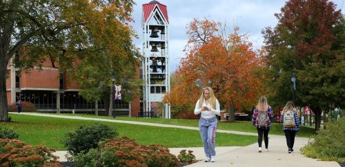 Lock Haven students walking by the Bell Tower