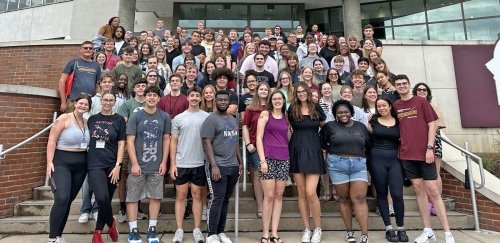 CU-Bloomsburg GHD and RA staff pose in front of David Soltz Hall.