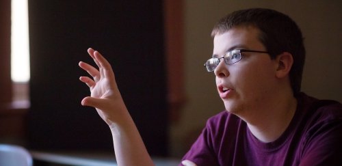 Student participating in discussion in Linguistics class.