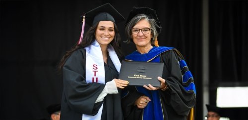 Lock Haven graduate receives diploma during Spring 2024 Commencement.