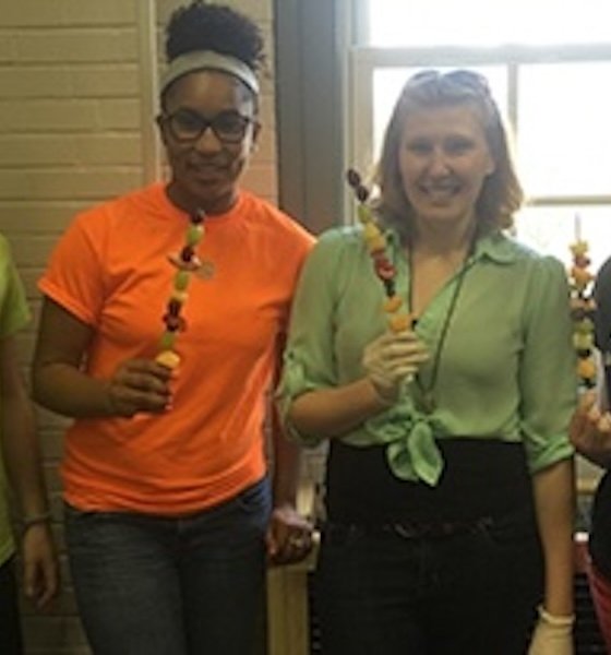 Nutrition students holding kabobs