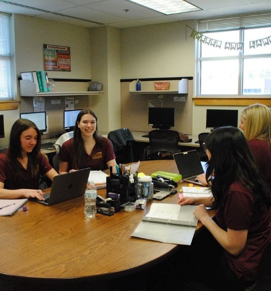 Graduate students from the Speech-Language Pathology program studying at a table