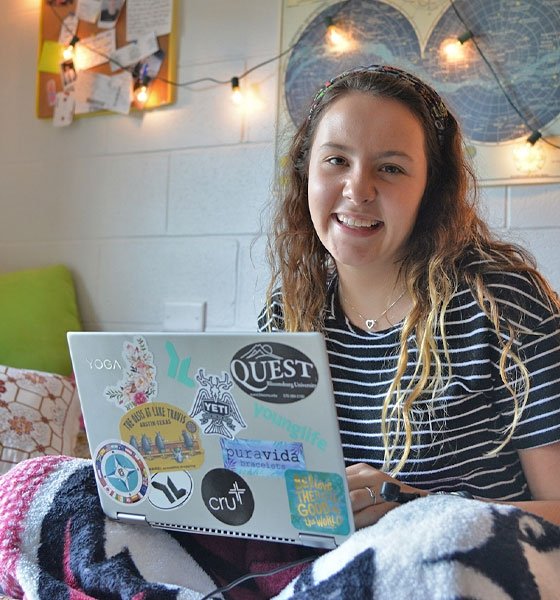 Female student using laptop in residence hall at Commonwealth University - Bloomsburg