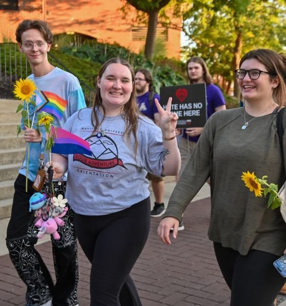 Commonwealth University-Mansfield, formerly Mansfield University, students march during a campus event with pride flags