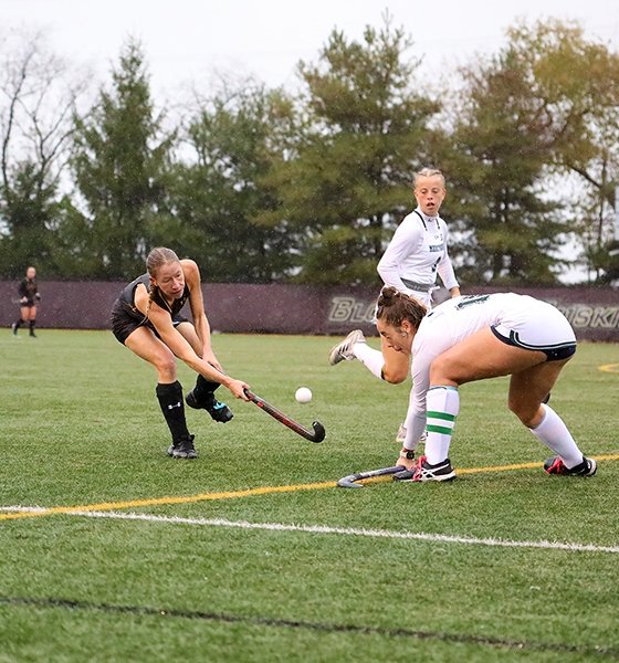 Field hockey player takes a shot on goal at Commonwealth University-Bloomsburg, formerly Bloomsburg University.