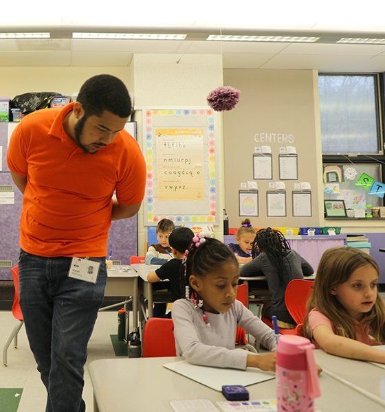 An education major observes kindergarten students in action at a Williamsport area elementary school.