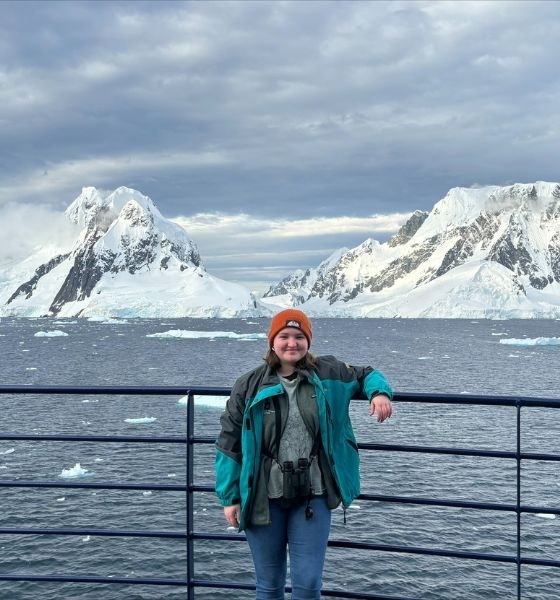 MS Biology student standing on a boat in Antarctica