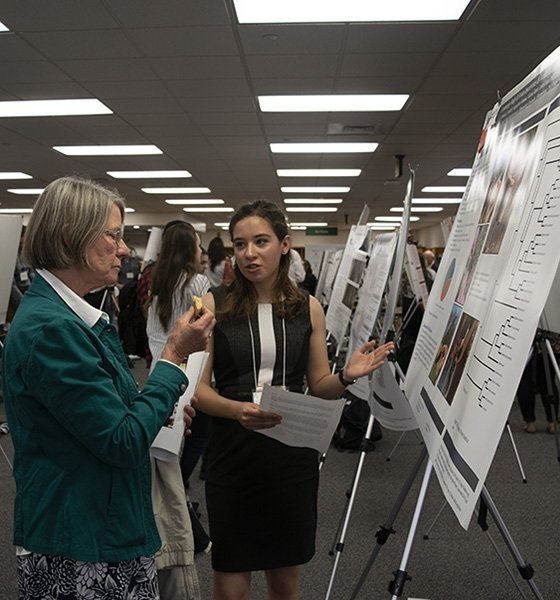 Jessica Paoletti presenting a poster at COST Research Day