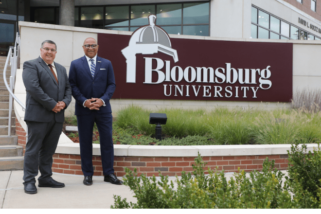 Pennsylvania Auditor General, Timothy L. DeFoor (right) stands next to Dr. Todd Shawver, dean of the Zeigler College of Business