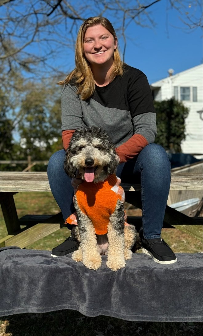 a photo of Danielle Passifone with a dog outside smiling