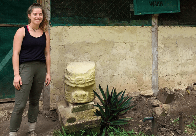 Ariana Ambrosio, anthropology student, standing outside at a historic location.