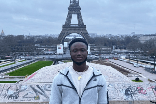 Ibrahima Barry near the Eiffel Tower in Paris, France