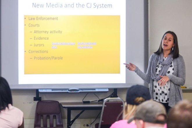 A CU-Lock Haven professor teaches lecturing a class on the topic of new media and the criminal justice system