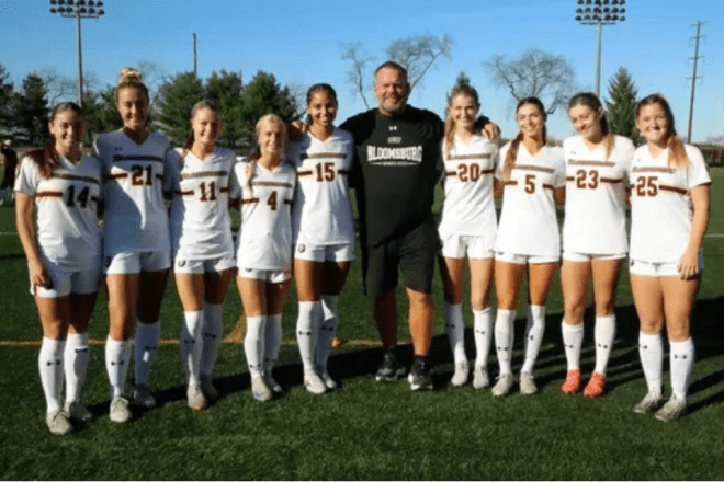 Women's Soccer team with coach