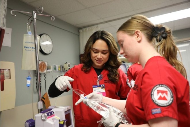 Two Nursing students from CU-Mansfield in a clinical setting 