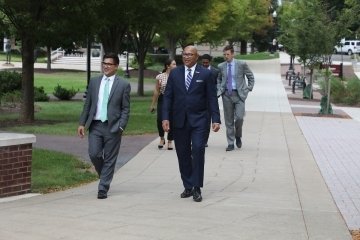 Pennsylvania Auditor General, DeFoor (right) walks through the BU campus with Dan Knorr, Director of External and Government Relations (left). Hayden Rigo is pictured back right.