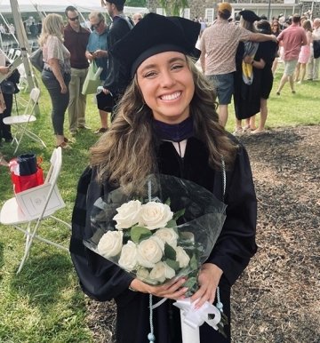 A girl holding flowers. 