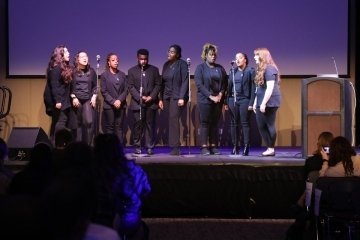 A group on stage. 