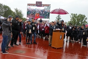 A group of people standing outside together.