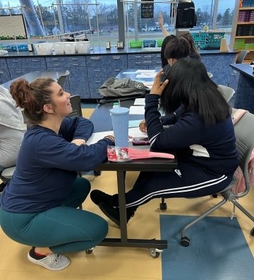 Katie Loch '21 speaks to one of her students at Seaford Area School District.