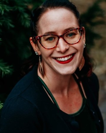 A headshot of a woman. 