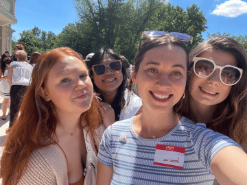 Four people taking a selfie together. 