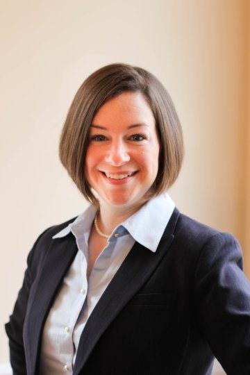 A headshot of a woman. 