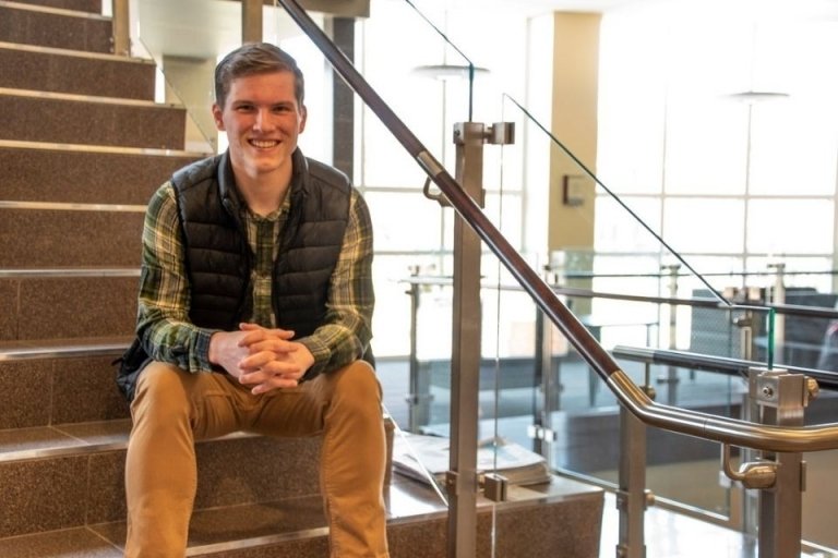 a man sitting on a staircase. 