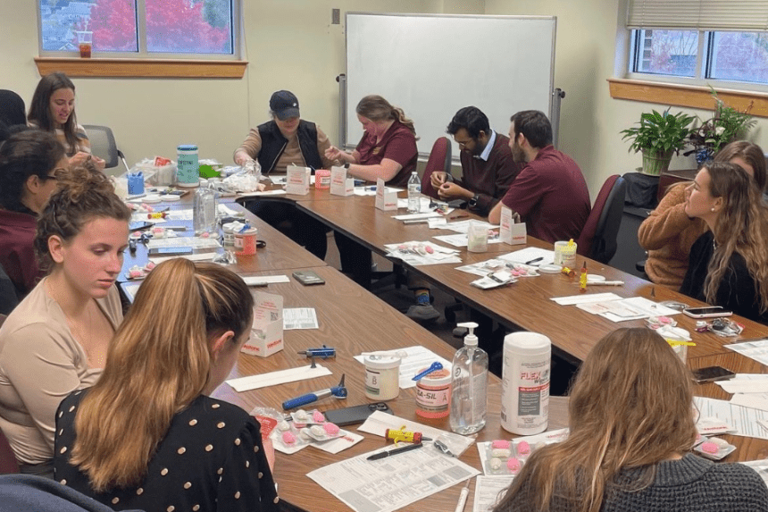 Audiology students working on creating earmolds