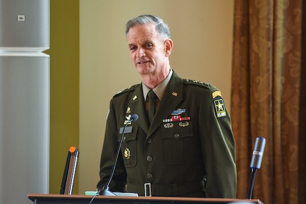 A man speaking at a podium. 